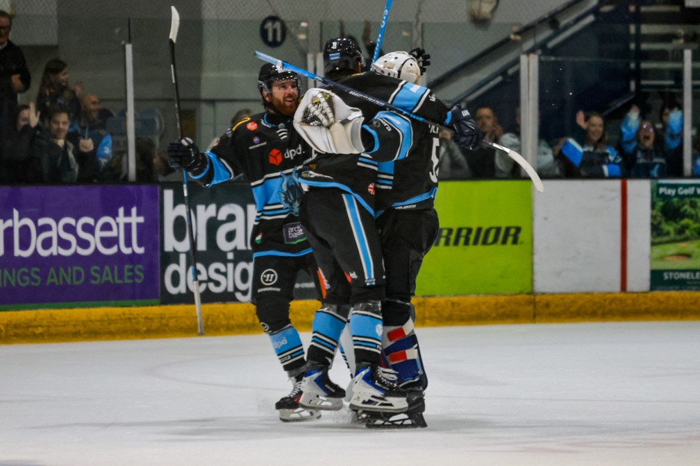 Blaze players celebrate a penalty shots victory 